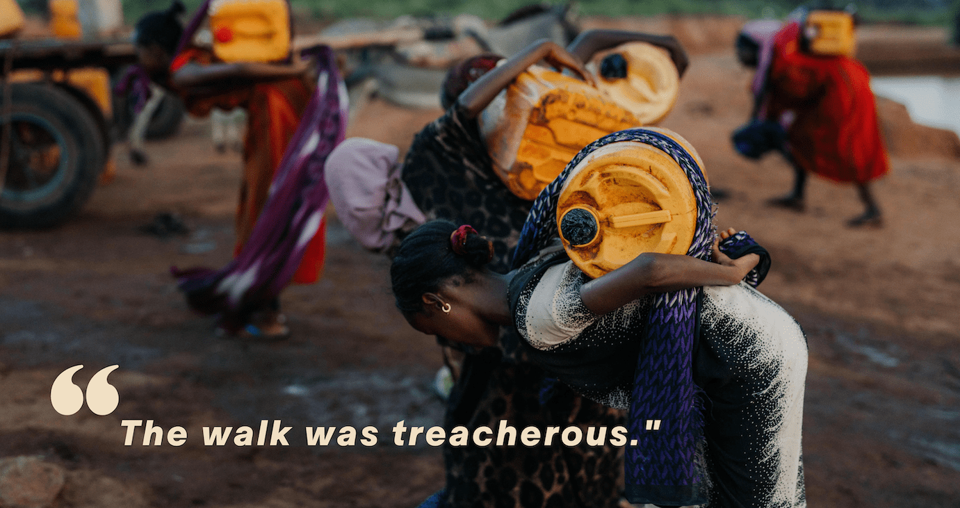 A group of women carrying large yellow water containers on their backs walk on a dirt path. Text reads: The walk was treacherous.