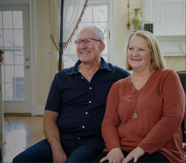 A black right-pointing arrow inside a yellow circle with a dark border, resembling a navigation or forward button.